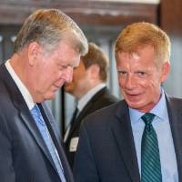 President Haas speaks with male attendee